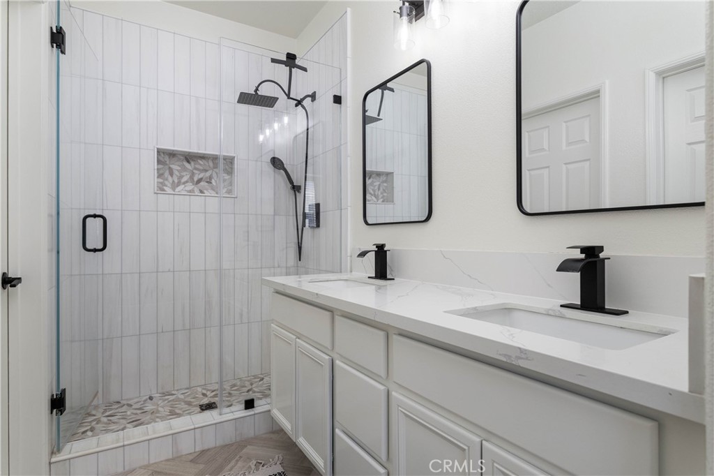 42 Chadron Circle Ladera Ranch, CA 92694 - Photo 11 of 27 a bathroom with a sink and a mirror