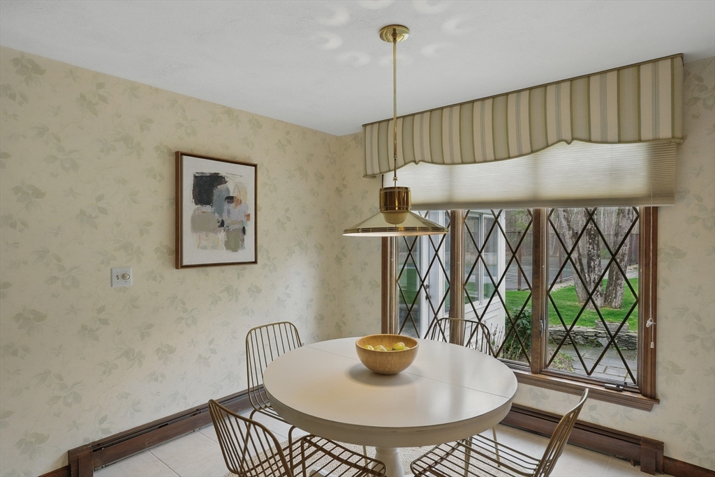 14 Harvard Drive Bedford, MA 01730 - Photo 16 of 40 a table and chairs in a patio