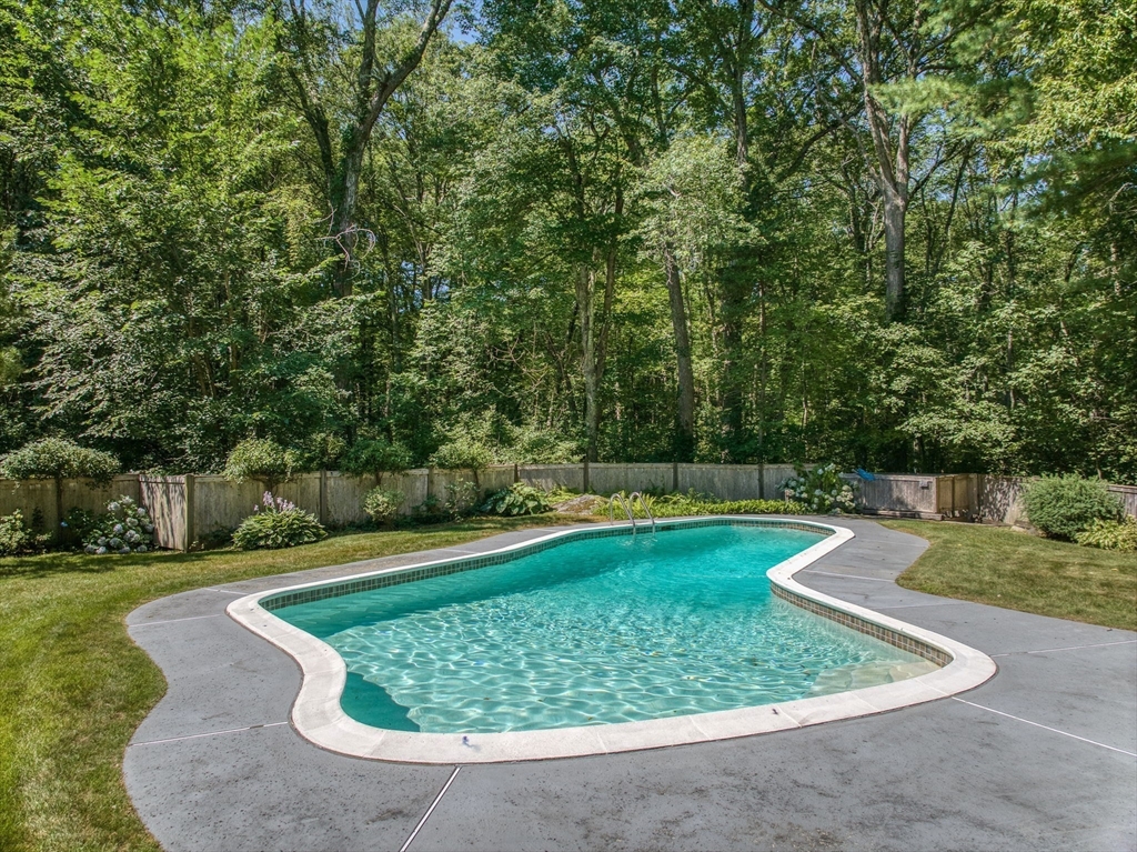 14 Harvard Drive Bedford, MA 01730 - Photo 2 of 40 a view of a backyard with swimming pool