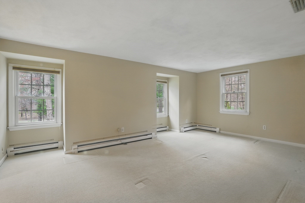 14 Harvard Drive Bedford, MA 01730 - Photo 26 of 40 an empty room with windows