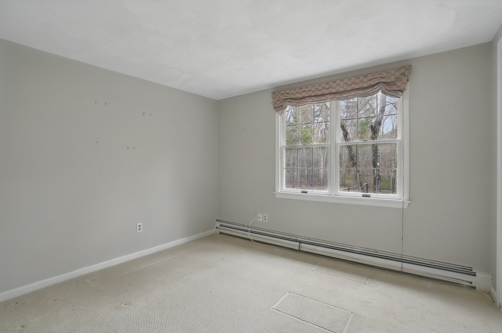 14 Harvard Drive Bedford, MA 01730 - Photo 27 of 40 an empty room with a window