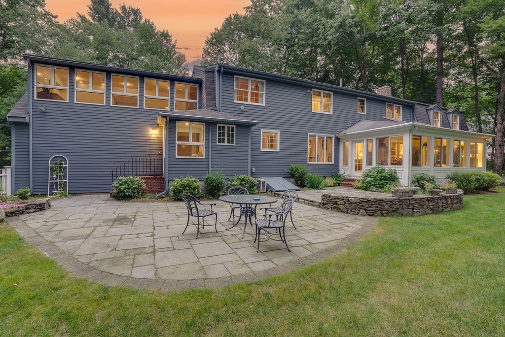 14 Harvard Drive Bedford, MA 01730 - Photo 3 of 40 a front view of a house with garden