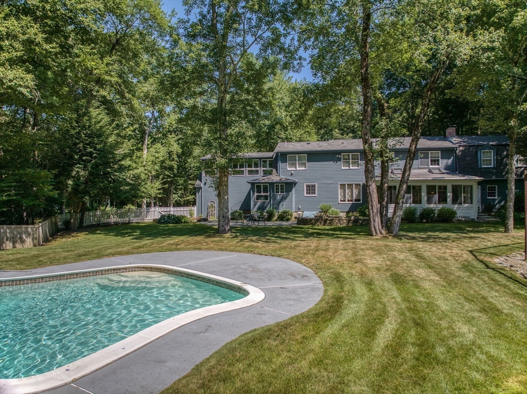 14 Harvard Drive Bedford, MA 01730 - Photo 32 of 40 a view of a house with swimming pool and yard with trees