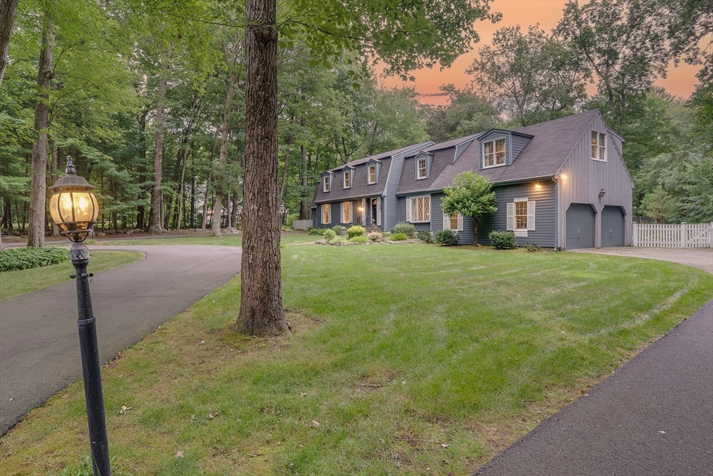 14 Harvard Drive Bedford, MA 01730 - Photo 39 of 40 a front view of a house with a yard and garage