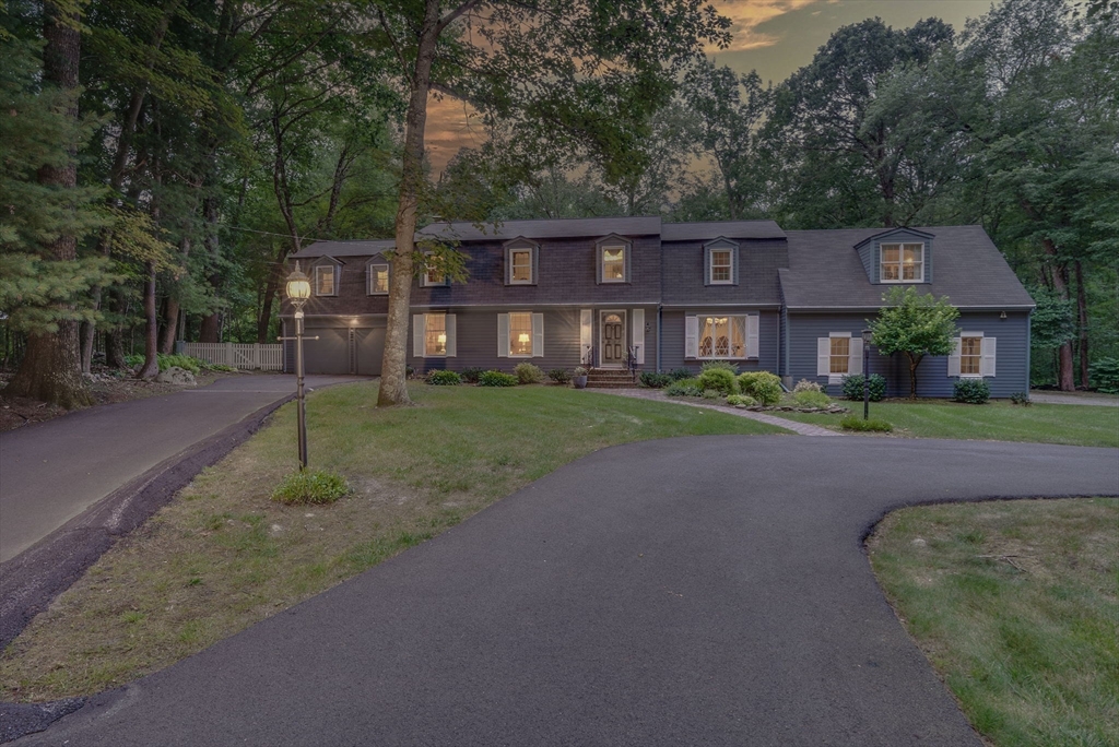 14 Harvard Drive Bedford, MA 01730 - Photo 40 of 40 a front view of a house with a garden and trees