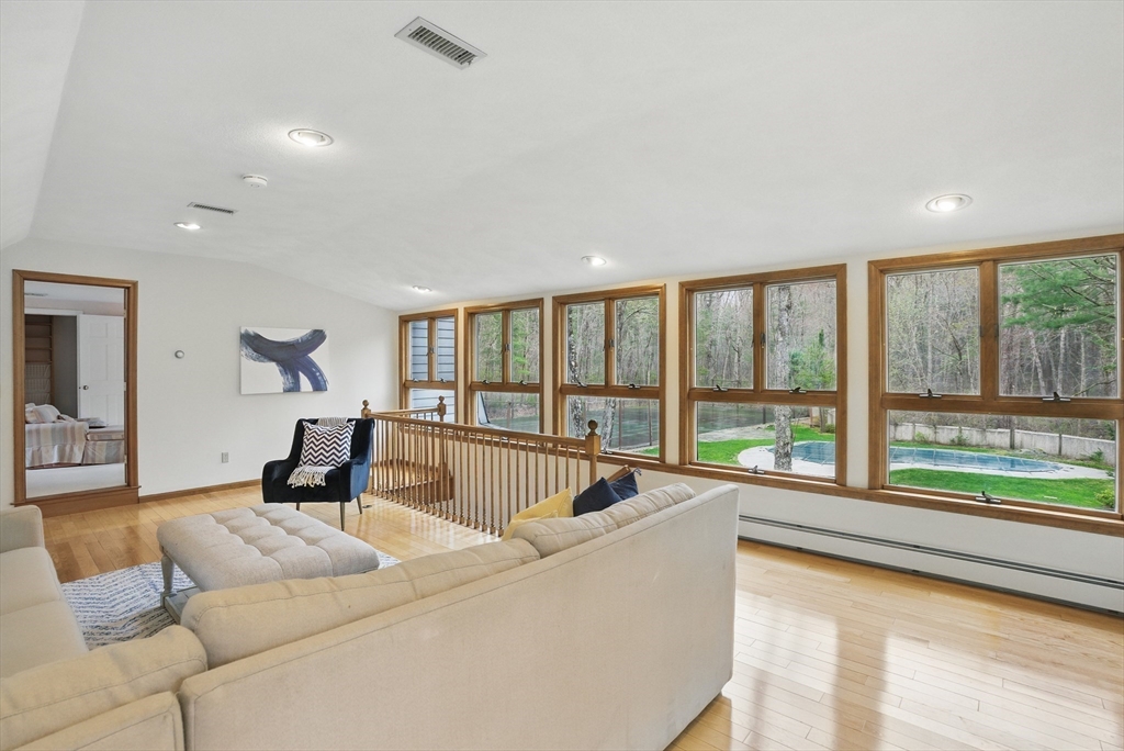 14 Harvard Drive Bedford, MA 01730 - Photo 4 of 40 a living room with furniture and a large window