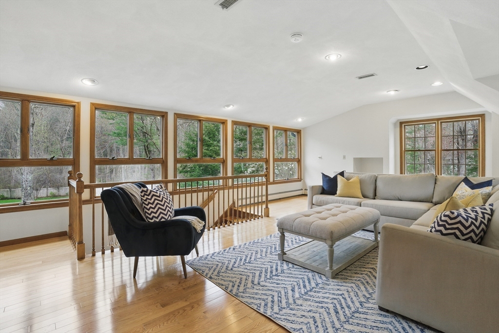 14 Harvard Drive Bedford, MA 01730 - Photo 5 of 40 a living room with furniture and a large window