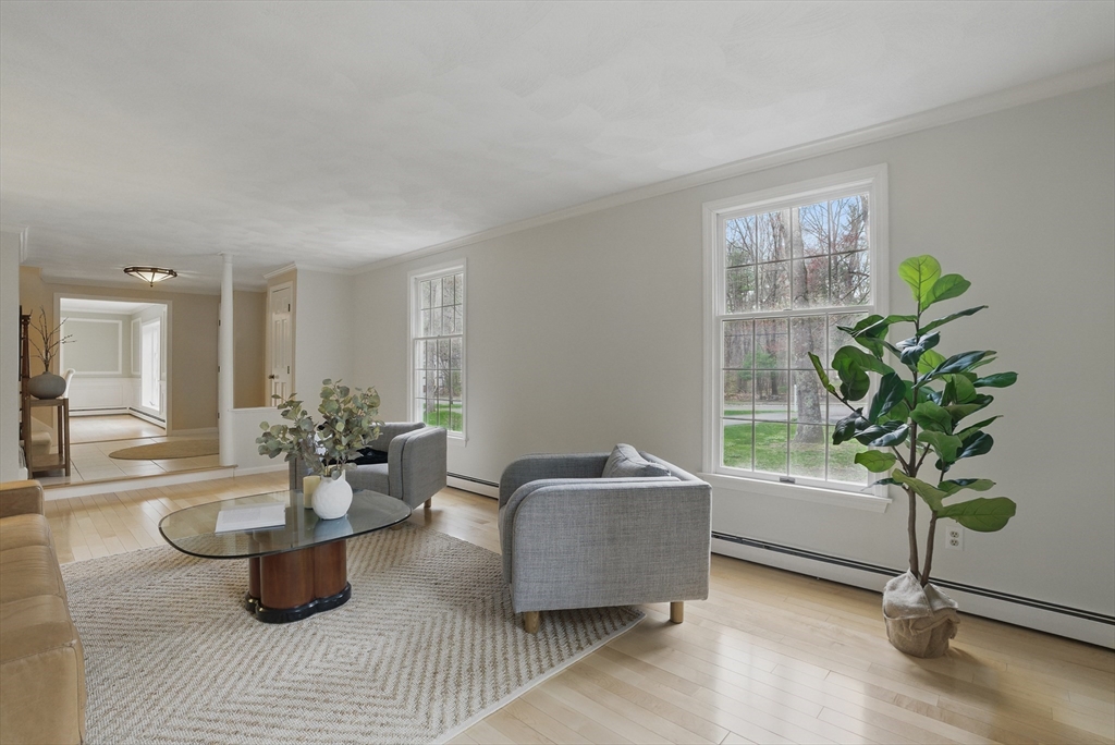 14 Harvard Drive Bedford, MA 01730 - Photo 7 of 40 a living room with furniture and a potted plant