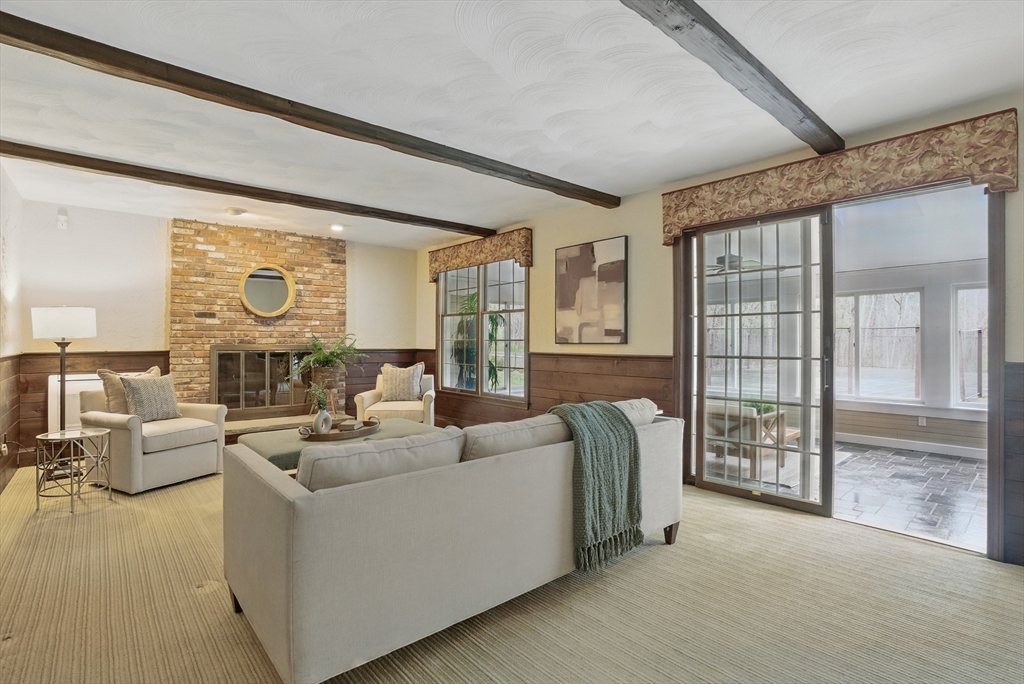 14 Harvard Drive Bedford, MA 01730 - Photo 10 of 40 a living room with furniture and large windows