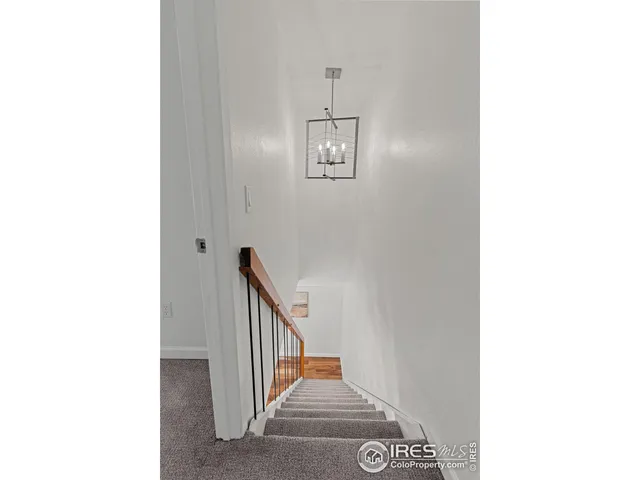 a view of a hallway with staircase