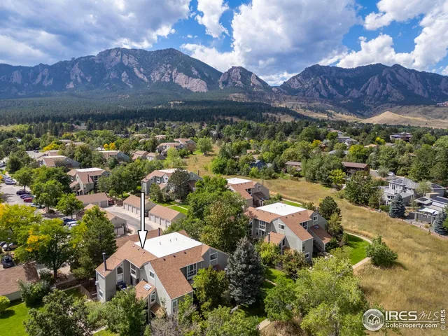 an aerial view of residential houses and outdoor space
