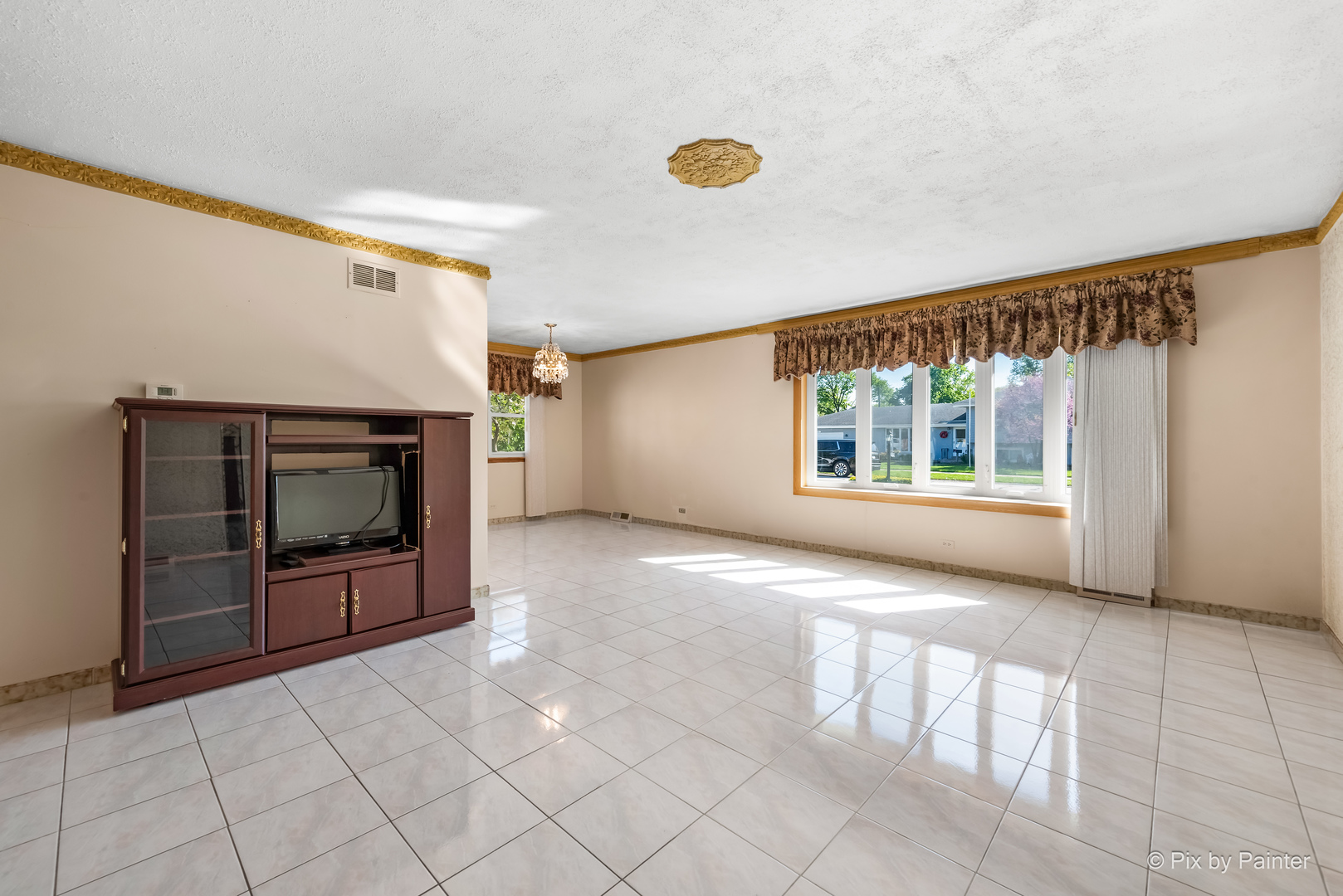 522 Park Place Addison, IL 60101 - Photo 3 of 31 a view of an empty room with a window and fire place