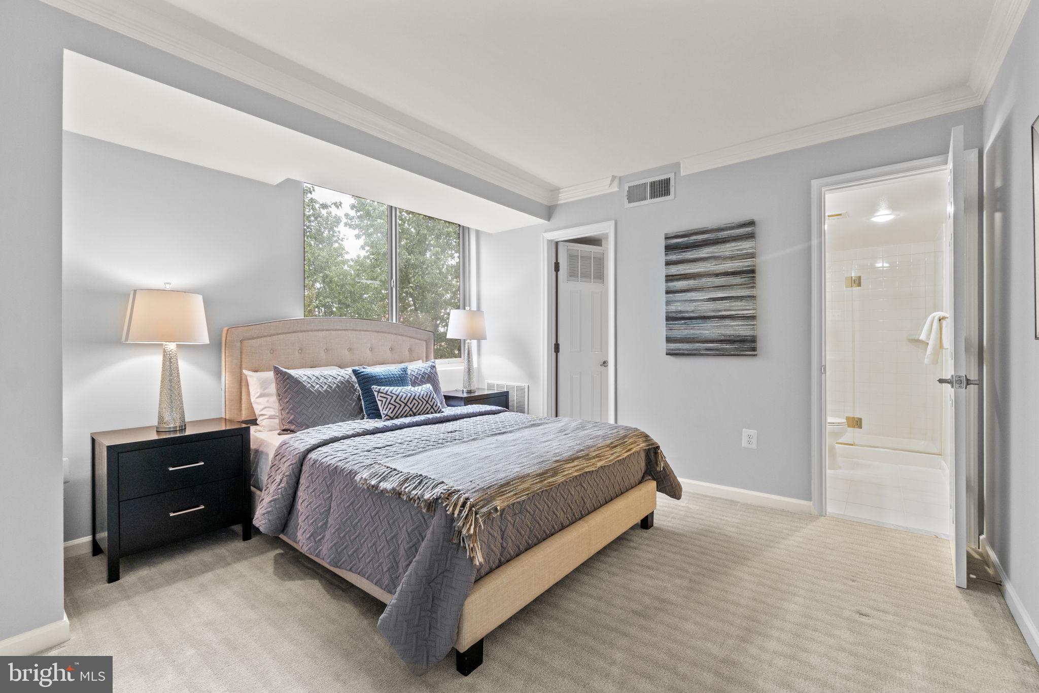 1515 South Arlington Ridge Road, Unit 603 Arlington, VA 22202 - Photo 12 of 22 a bed room with a bed and a night stand