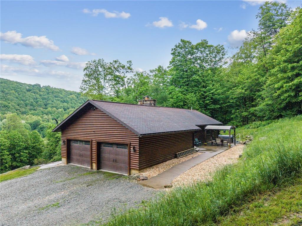 905 Indian Creek Valley Road Normalville, PA 15469 - Photo 2 of 38 a house with trees in the background