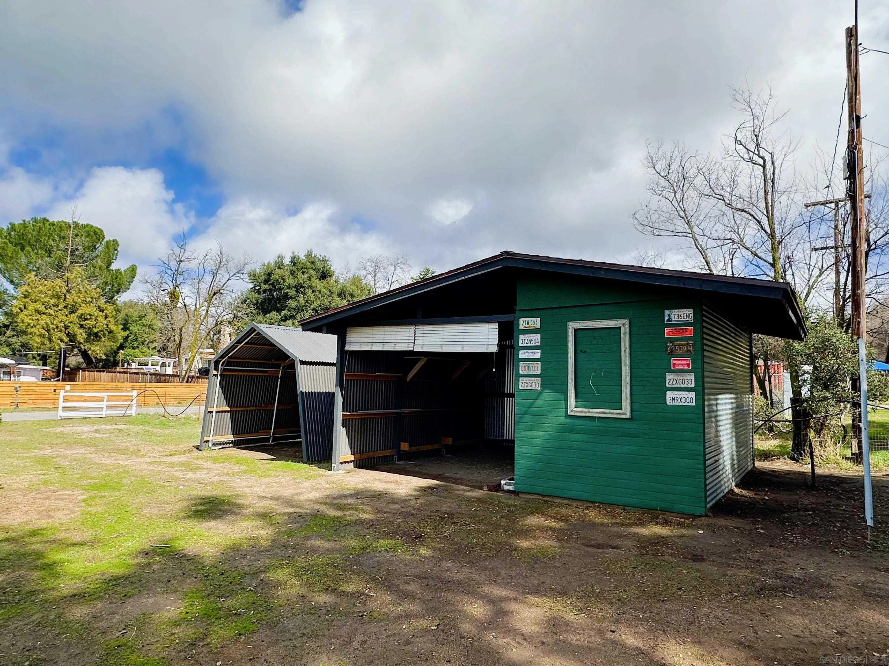 2441 Gladiola Drive Campo, CA 91906 - Photo 12 of 17 a front view of a house with a yard and garage