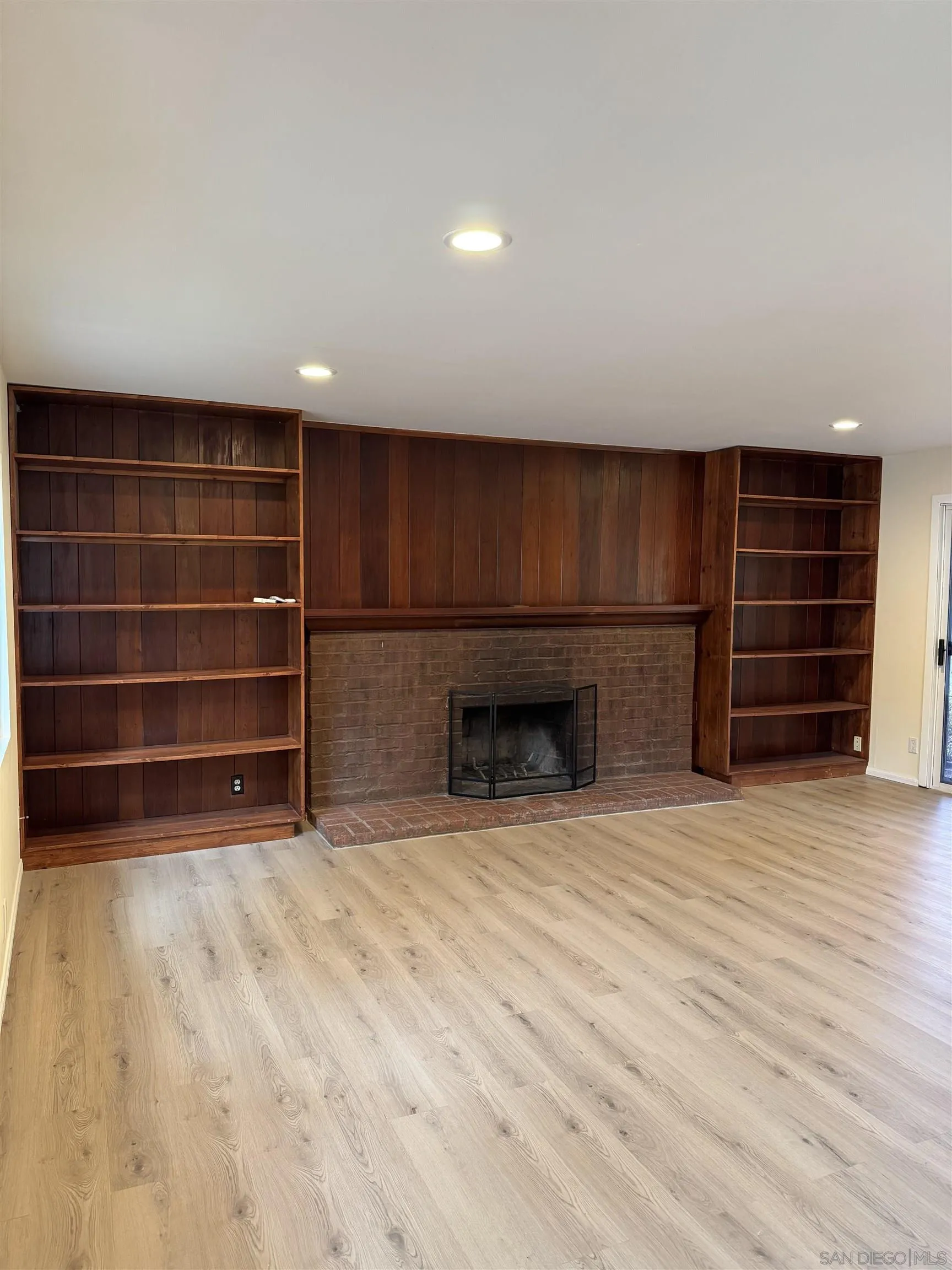 2441 Gladiola Drive Campo, CA 91906 - Photo 13 of 17 a view of an empty room with wooden floor and a window