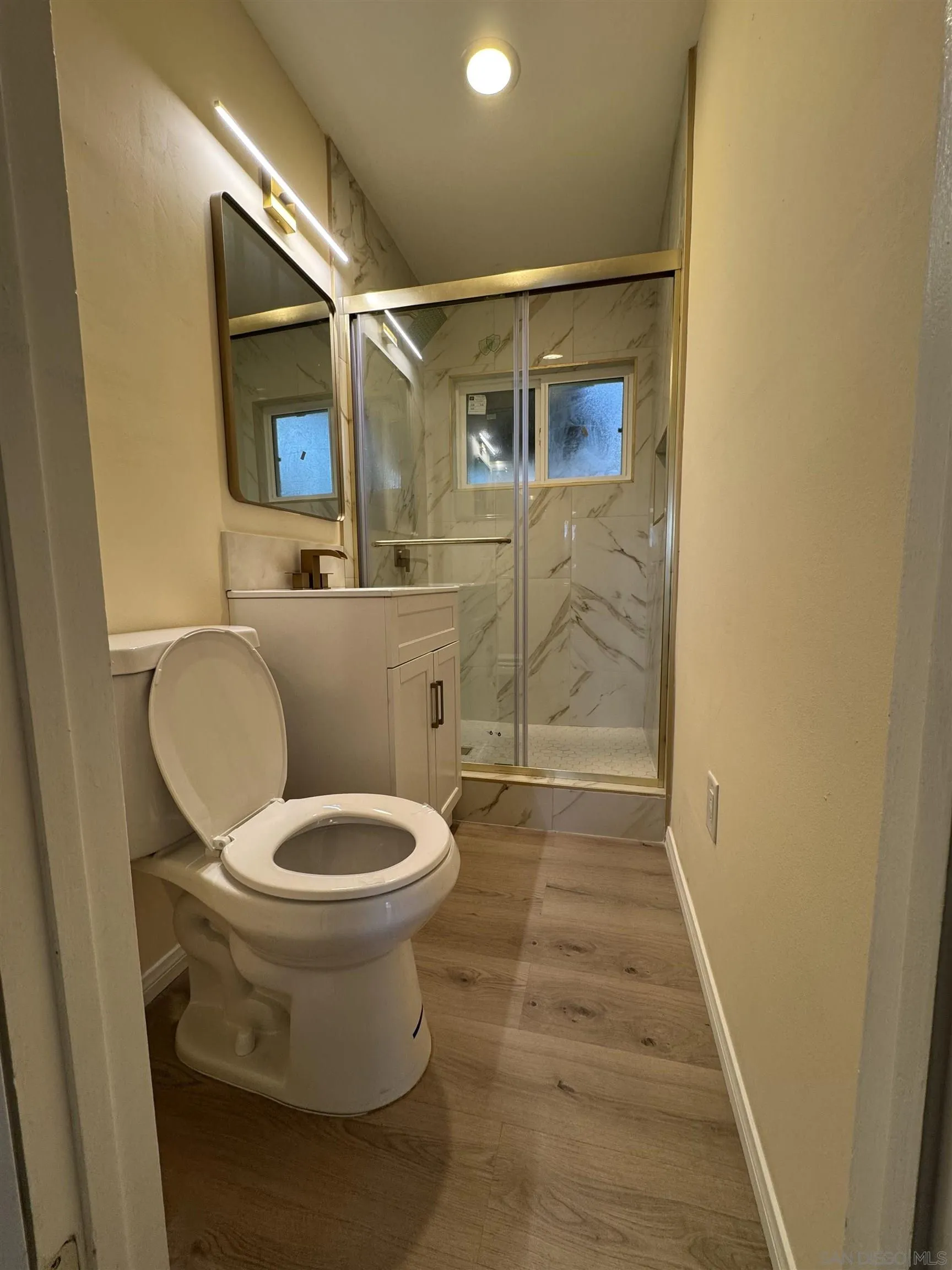 2441 Gladiola Drive Campo, CA 91906 - Photo 14 of 17 a bathroom with a toilet and a shower