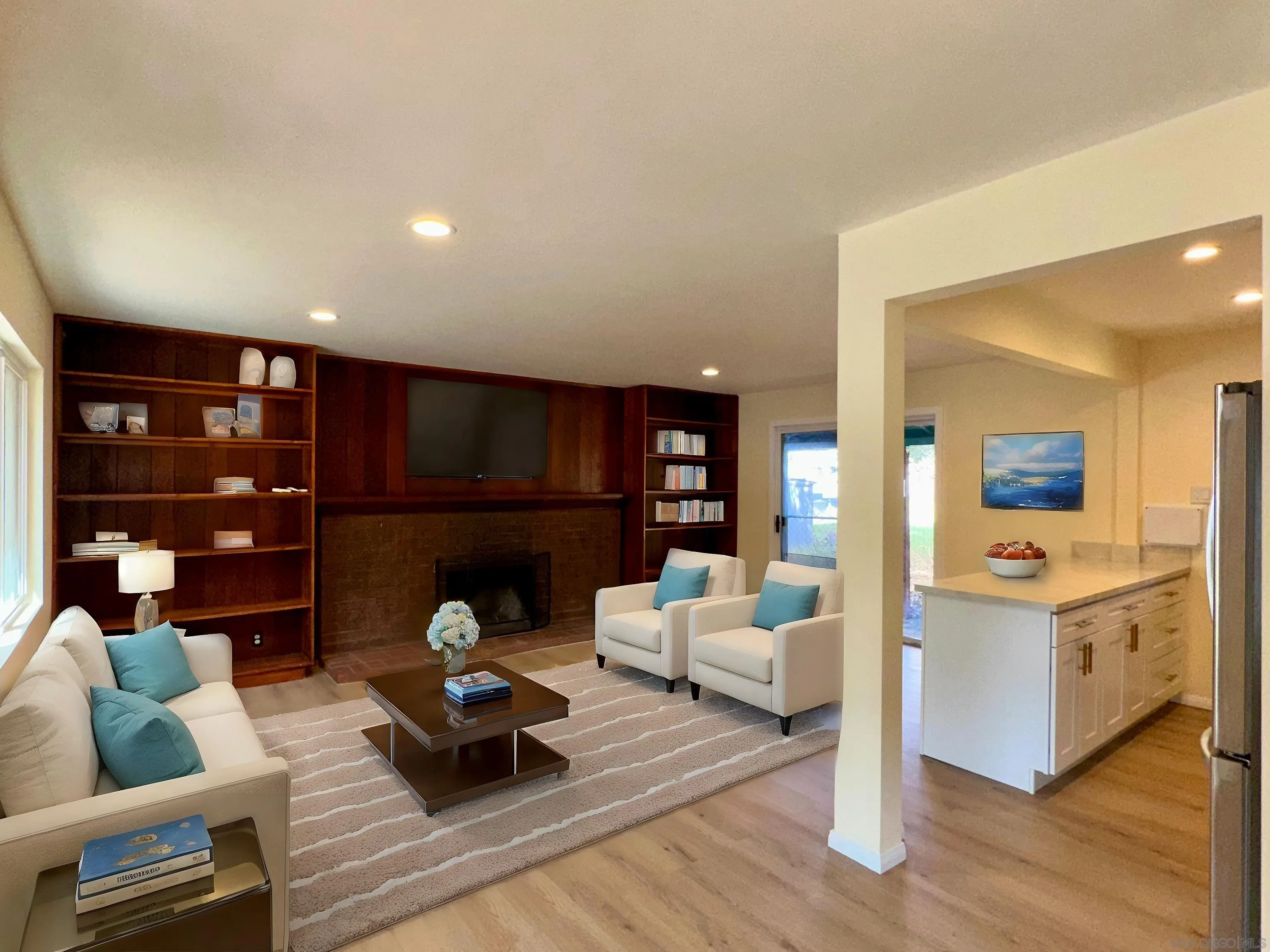 2441 Gladiola Drive Campo, CA 91906 - Photo 4 of 17 a living room with furniture hard wood floor and a book shelf