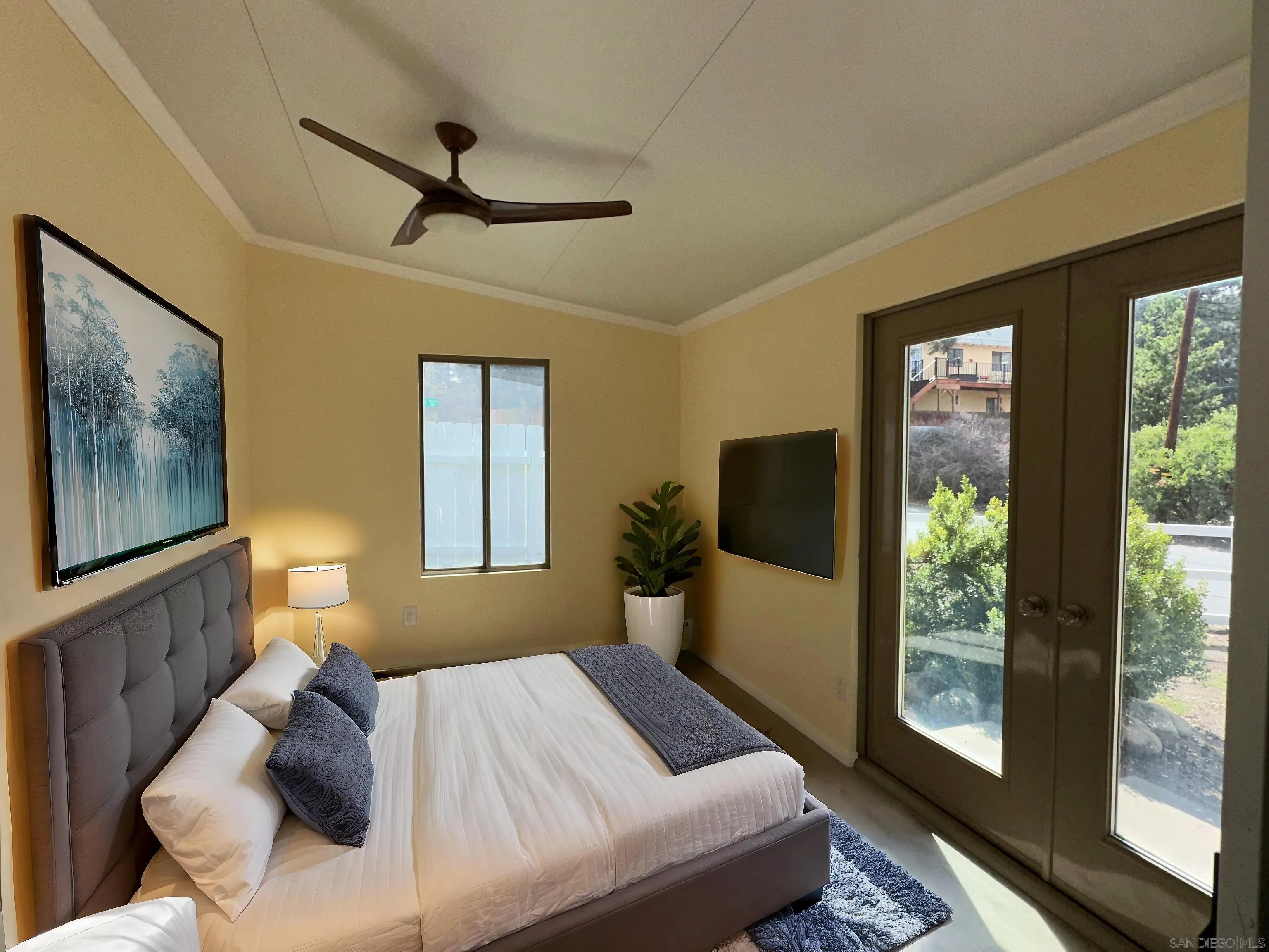 2441 Gladiola Drive Campo, CA 91906 - Photo 5 of 17 a bedroom with a large bed and a window