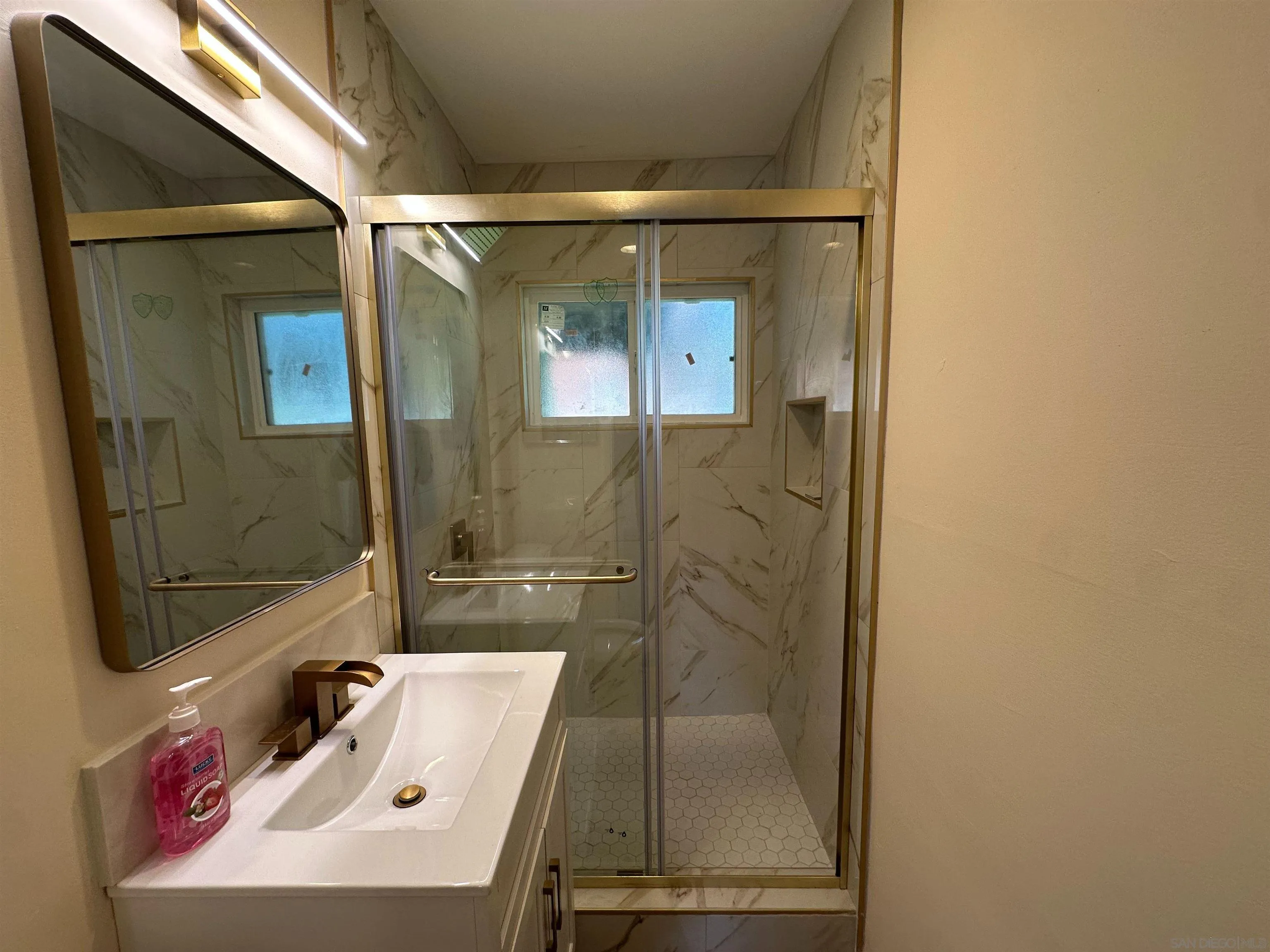 2441 Gladiola Drive Campo, CA 91906 - Photo 7 of 17 a bathroom with a sink and a mirror