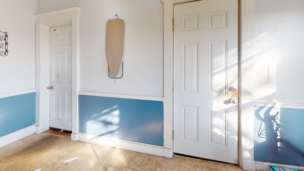 36 Mozart Street, Unit 3 Boston, MA 02130 - Photo 2 of 4 a view of front door with wooden floor