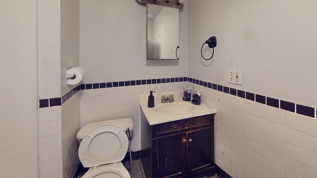 36 Mozart Street, Unit 3 Boston, MA 02130 - Photo 3 of 4 a bathroom with a sink and a mirror