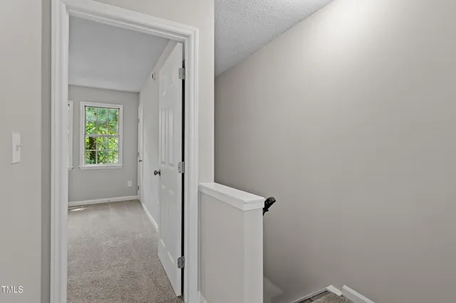 a view of a hallway with a closet