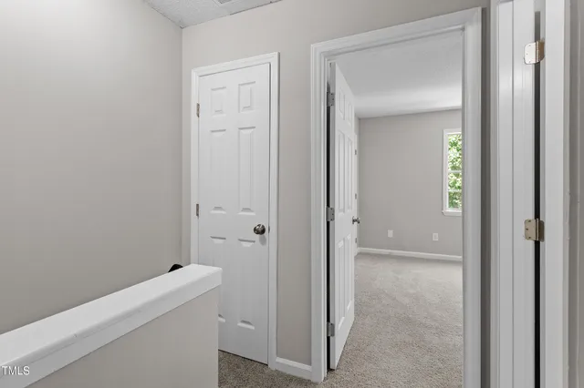 a view of a bathroom from a hallway