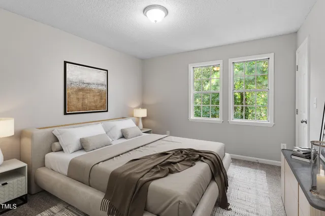 a bedroom with bed and a window