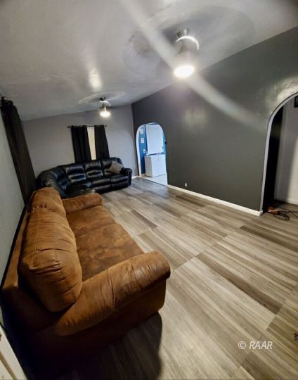 425 North Norma Street Ridgecrest, CA 93555 - Photo 32 of 33 a bedroom with a bed and a mirror
