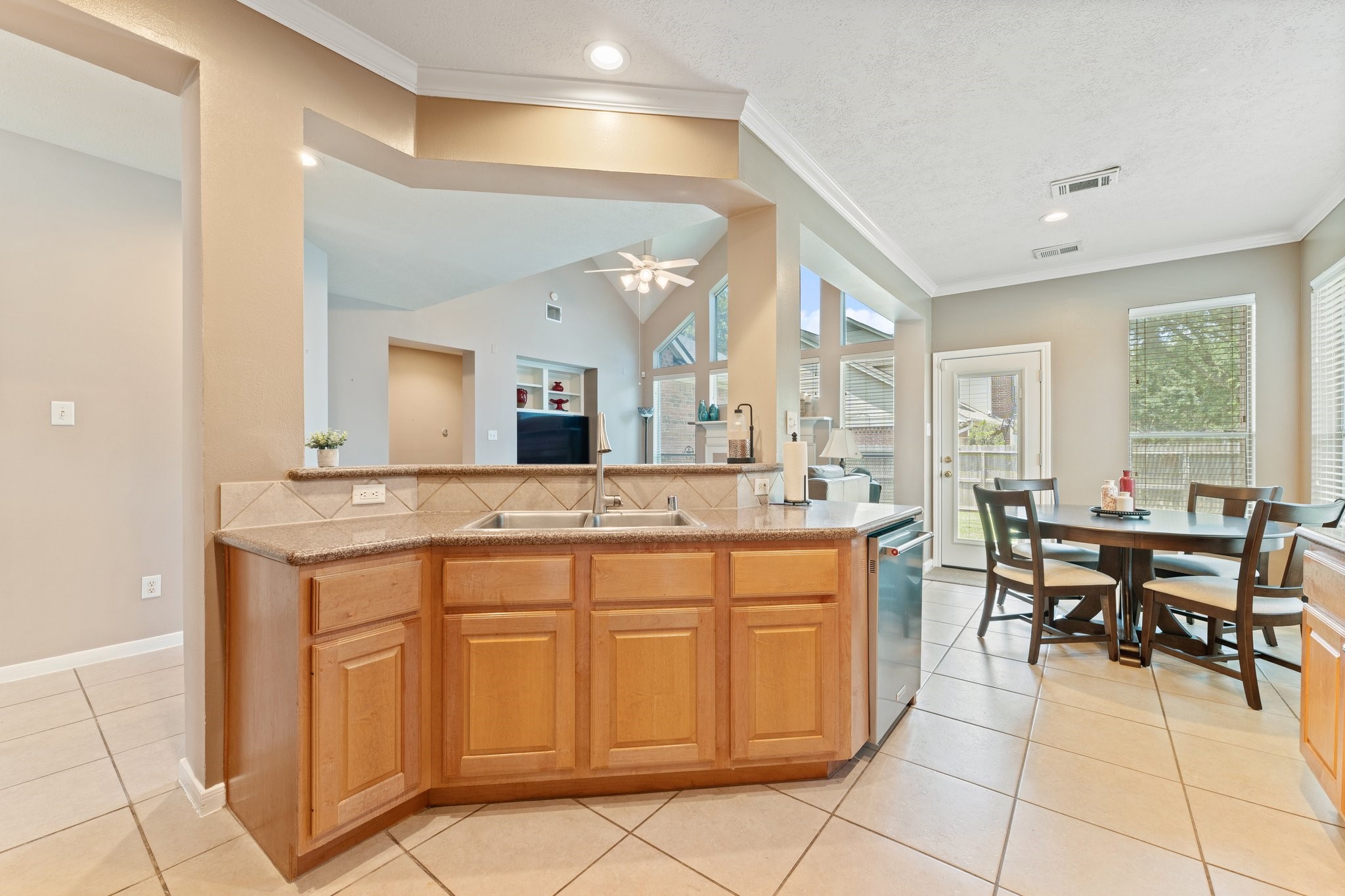25447 China Springs Spring, TX 77373 - Photo 12 of 45 The stainless sink overlooks the living area for easy and seamless entertaining.
