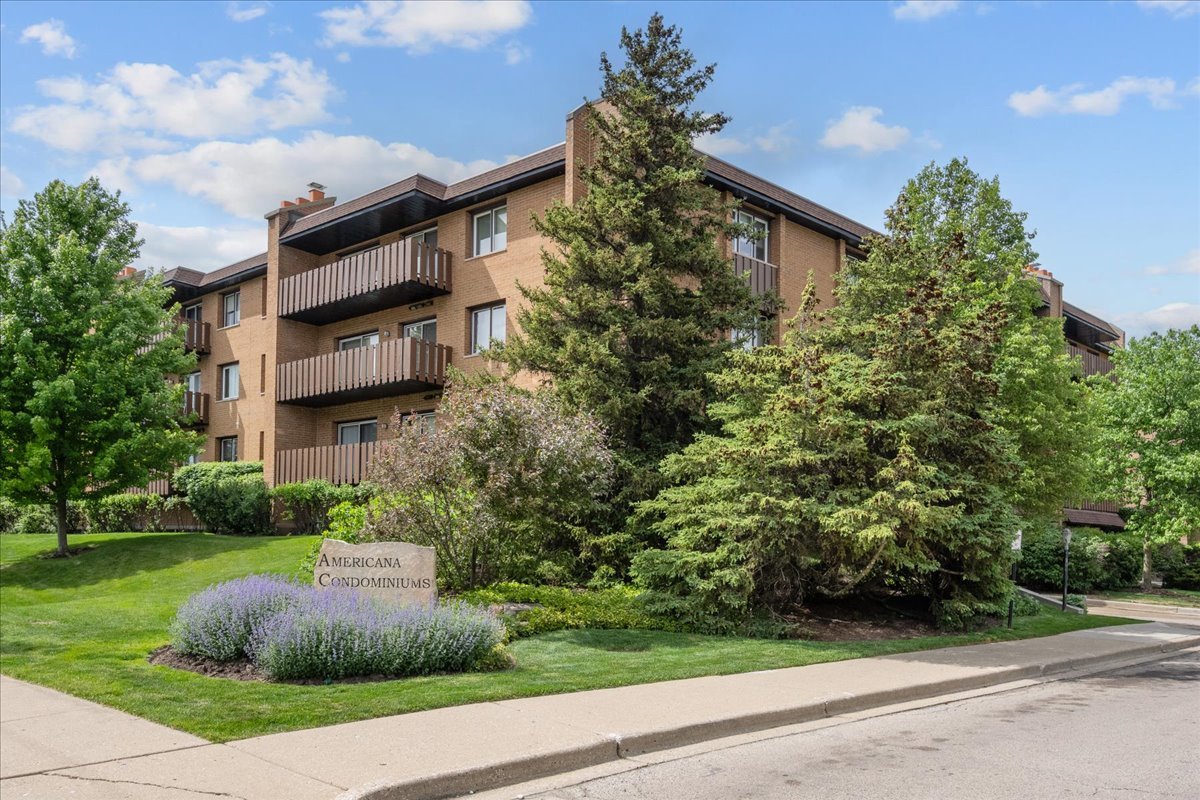 1795 Lake Cook Road, Unit 107 Highland Park, IL 60035 - Photo 1 of 26 a view of a house with a yard and plants