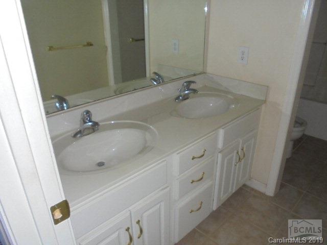 301 General Griffith Circle Rutherfordton, NC 28139 - Photo 3 of 17 a bathroom with a sink and a mirror