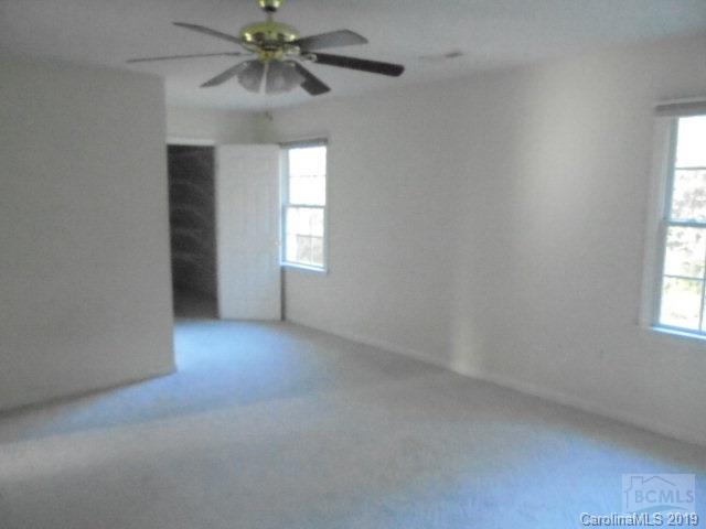 301 General Griffith Circle Rutherfordton, NC 28139 - Photo 4 of 17 a view of an empty room with a window