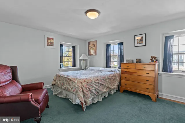 a bedroom with a bed and furniture