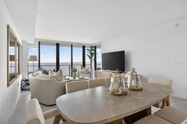 a kitchen with lots of counter top space and chairs
