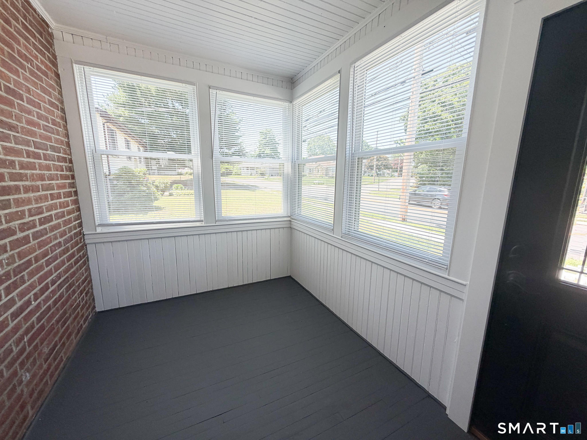 793 Milford Point Road, Unit 1 Milford, CT 06460 - Photo 15 of 16 an empty room with a window