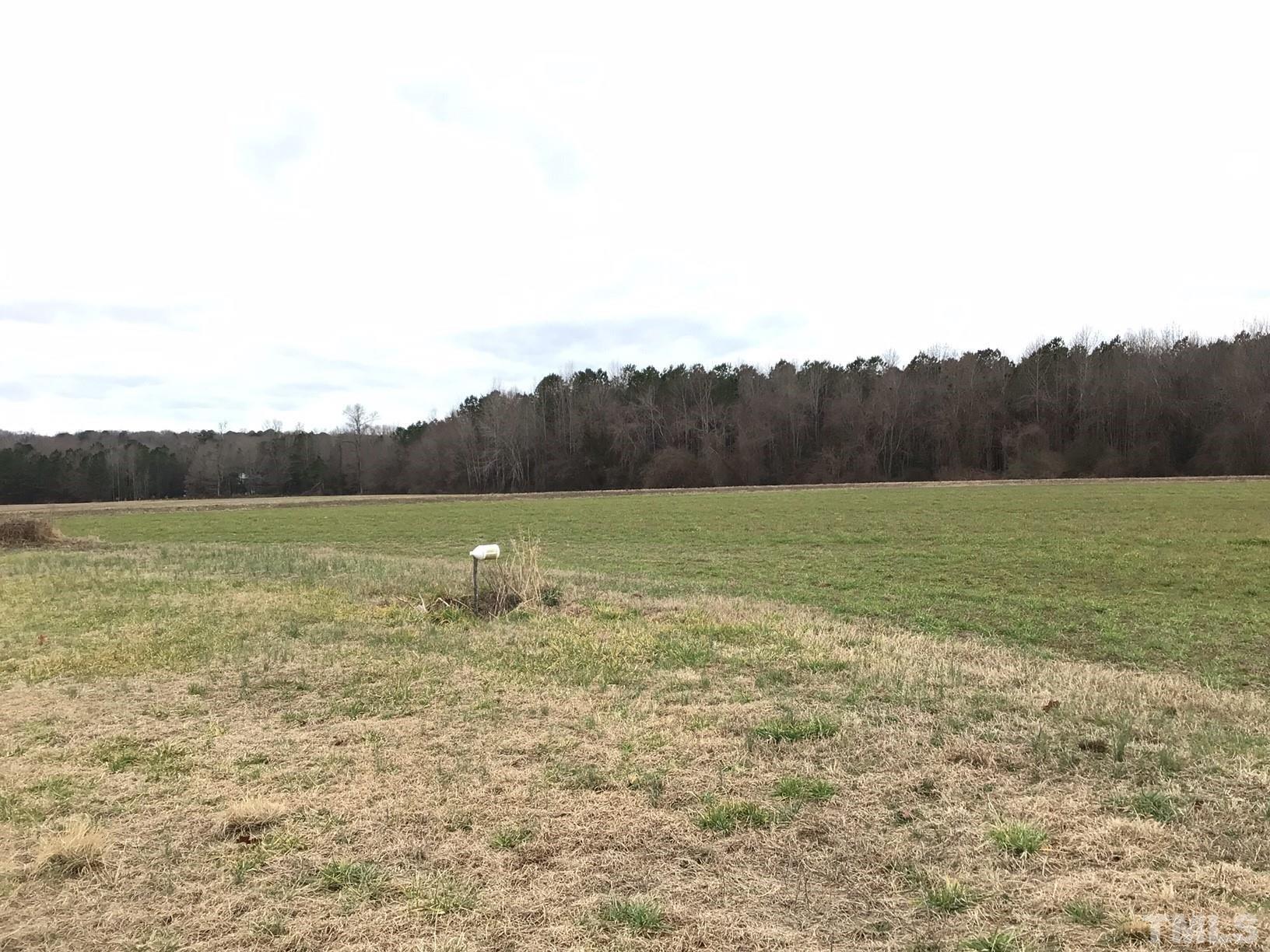 13920 Old Stage Road Willow Spring, NC 27592 - Photo 1 of 11 a view of a lake view and mountain view