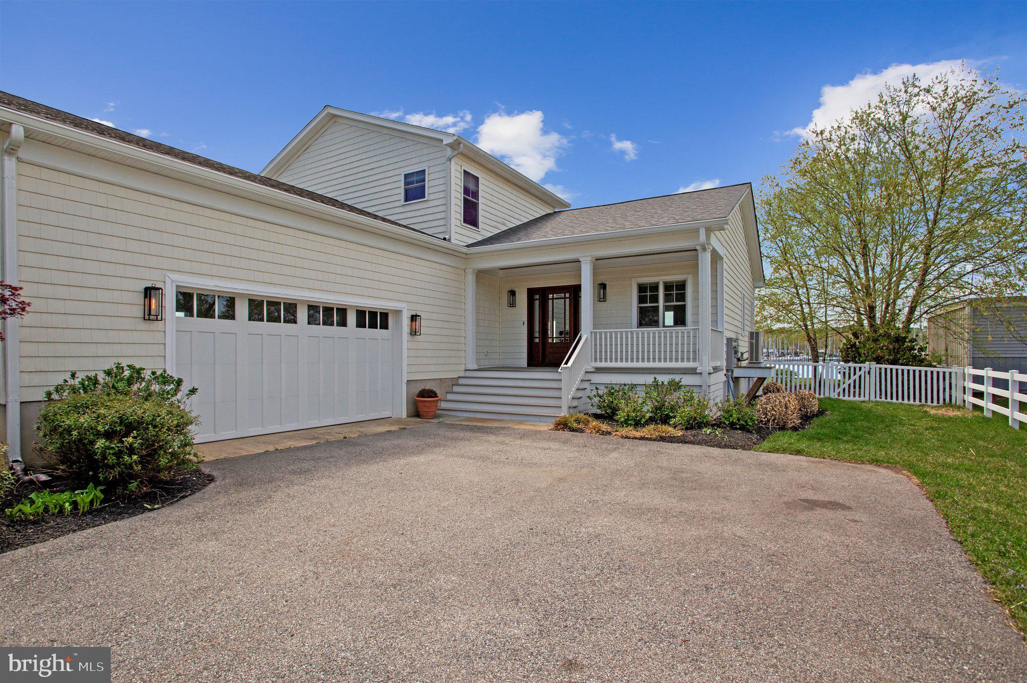 6146 Drum Point Road Deale, MD 20751 - Photo 2 of 75 a front view of a house with a yard and garage