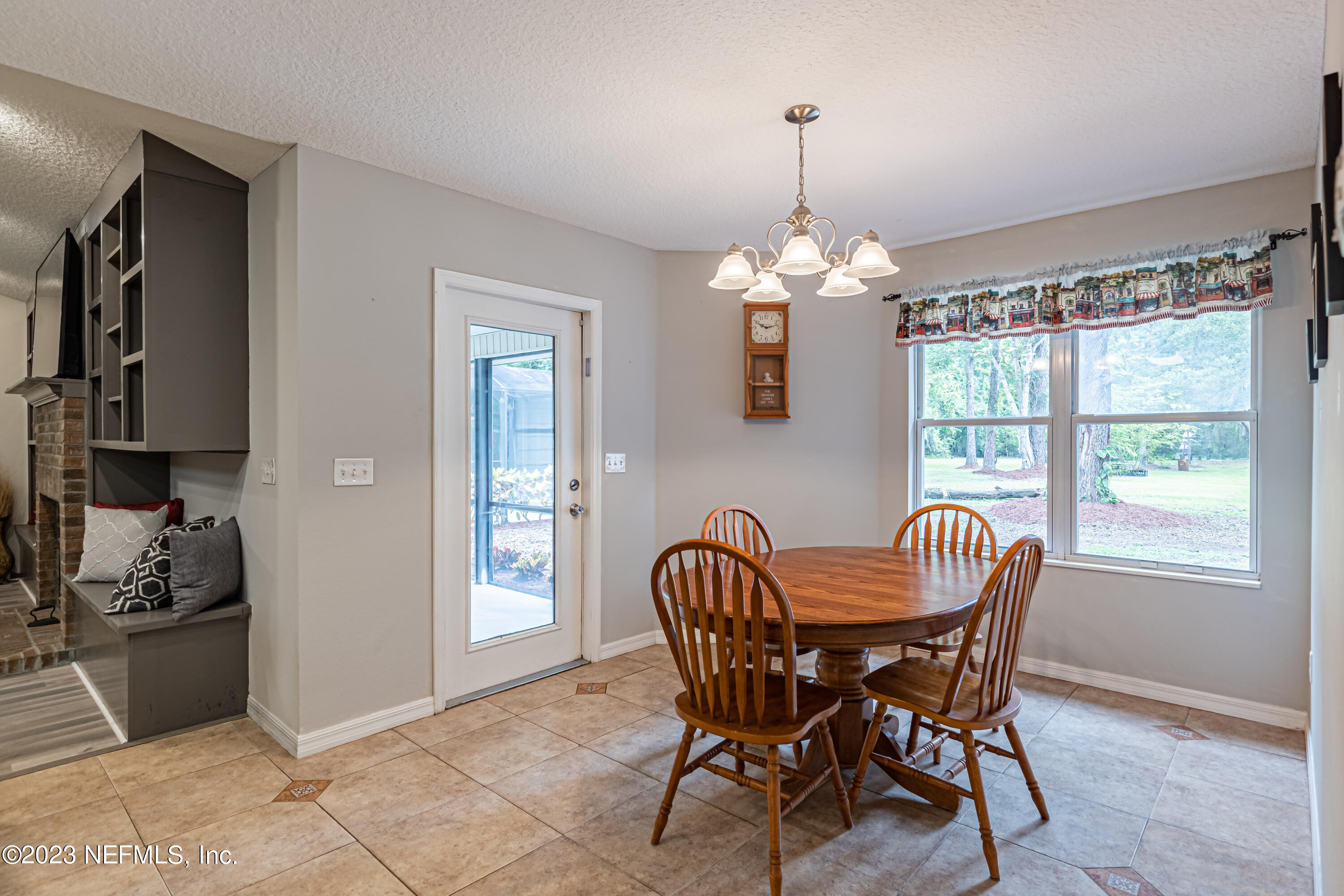1193 Marlee Road St. Johns, FL 32259 - Photo 18 of 63 a dining room with furniture a chandelier and window
