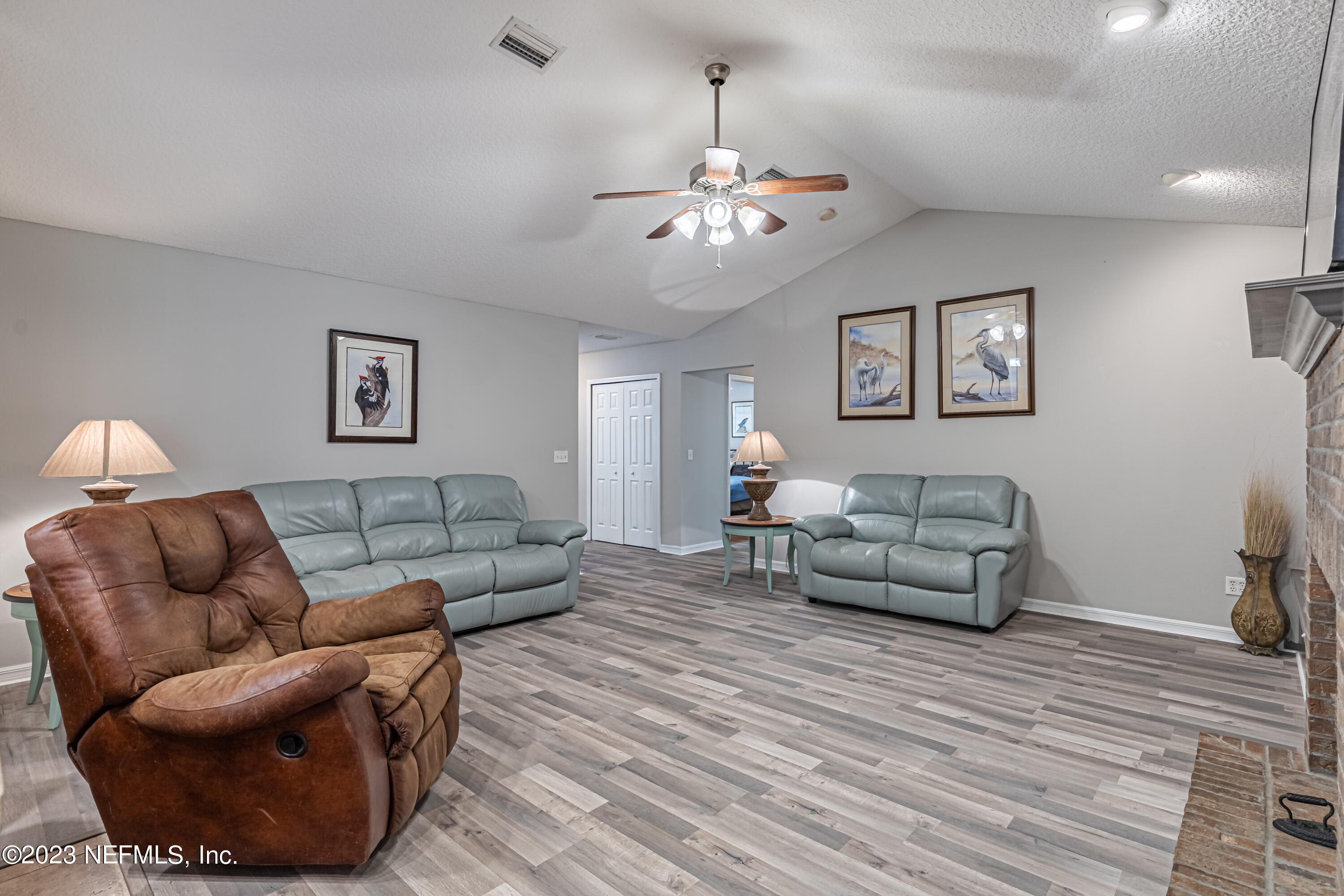1193 Marlee Road St. Johns, FL 32259 - Photo 20 of 63 a living room with furniture a couch and chandelier