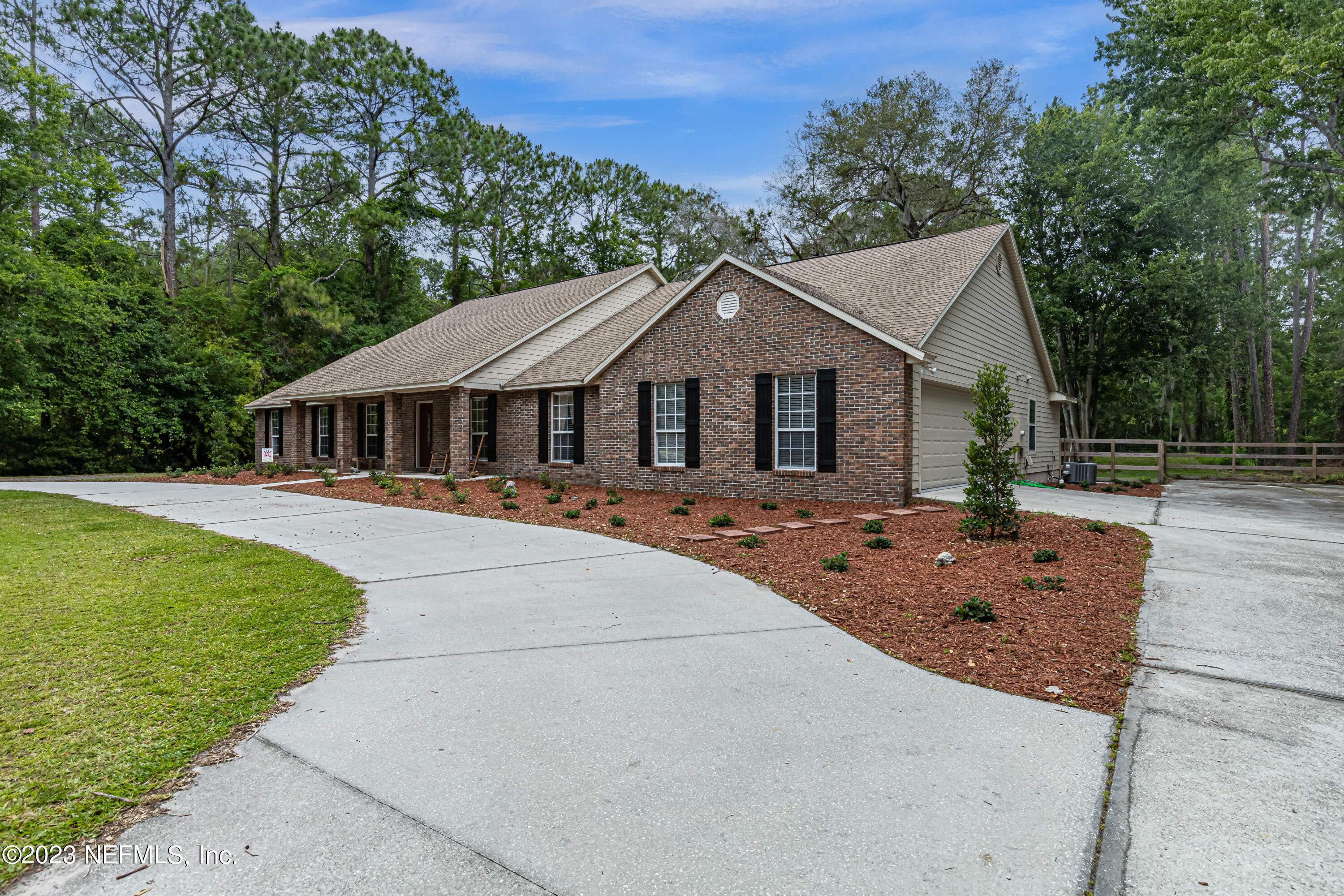 1193 Marlee Road St. Johns, FL 32259 - Photo 2 of 63 a front view of a house with a yard