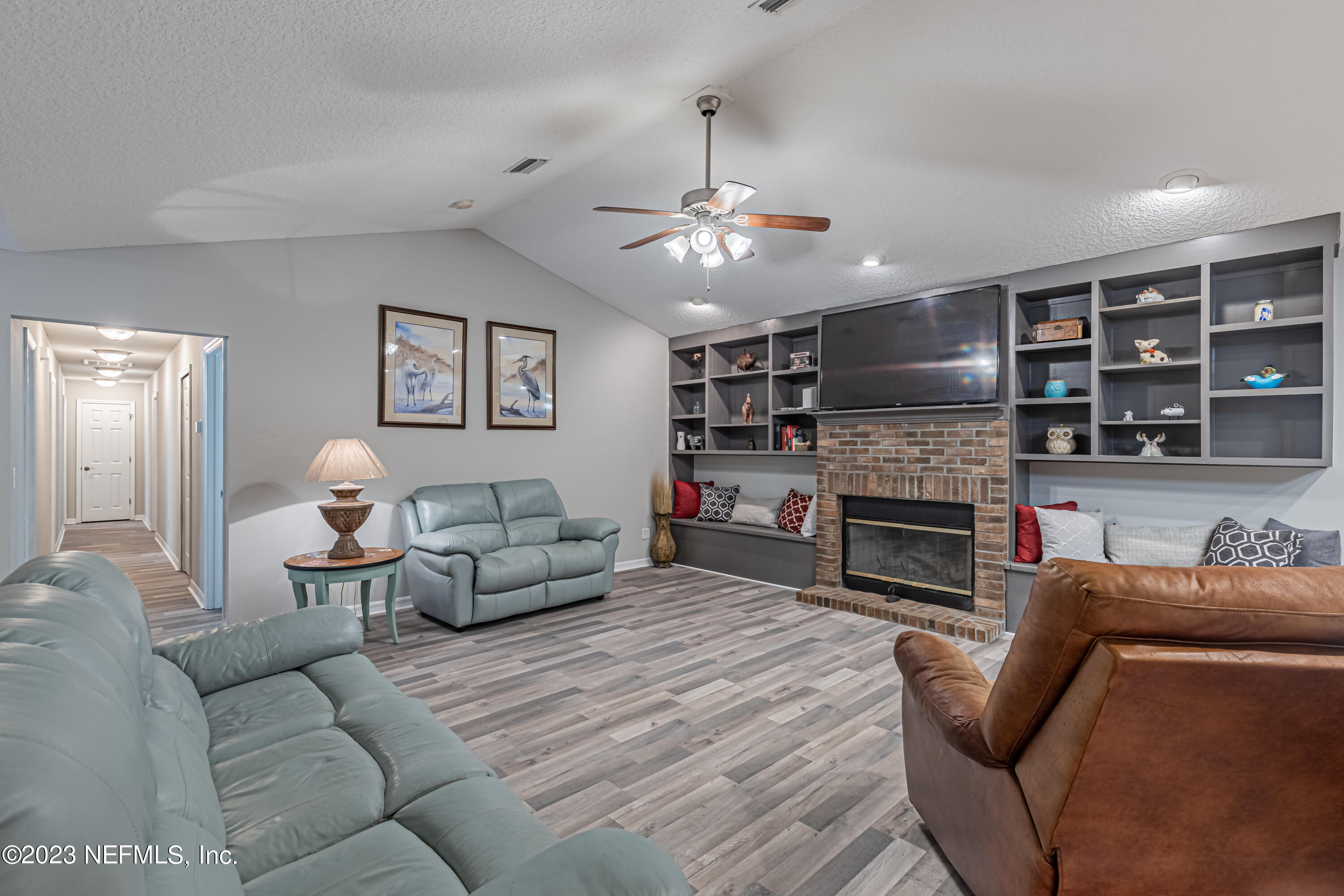1193 Marlee Road St. Johns, FL 32259 - Photo 21 of 63 a living room with furniture and a fireplace