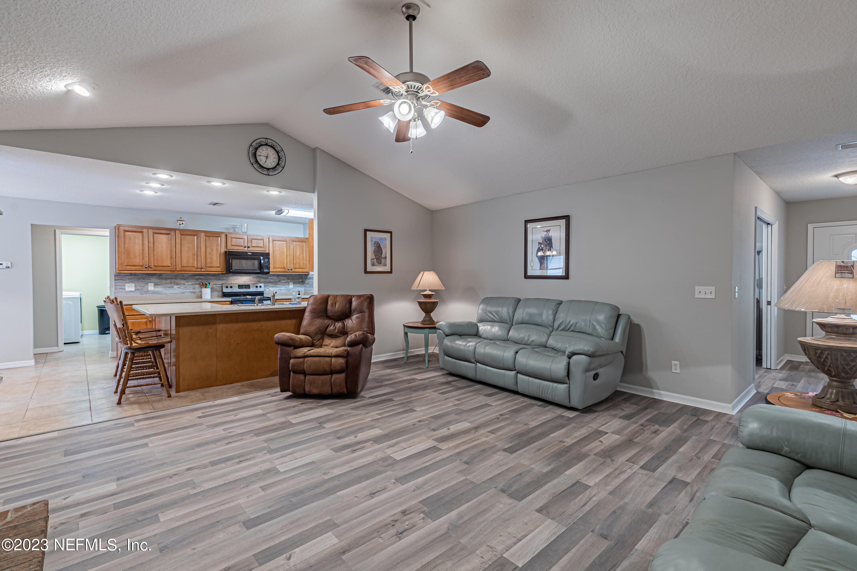 1193 Marlee Road St. Johns, FL 32259 - Photo 23 of 63 a living room with furniture and kitchen view
