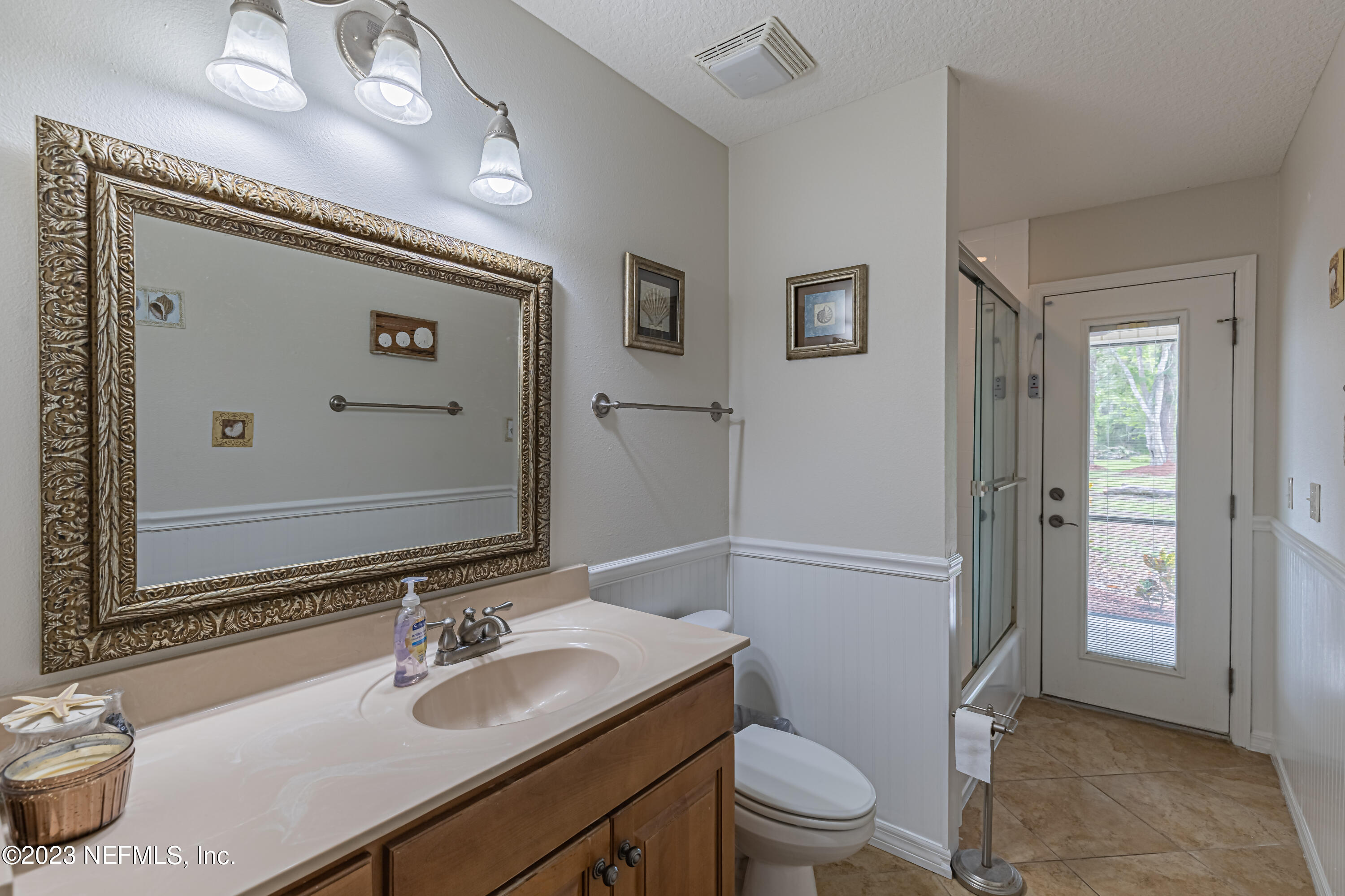 1193 Marlee Road St. Johns, FL 32259 - Photo 26 of 63 a bathroom with a sink a toilet a mirror and shower