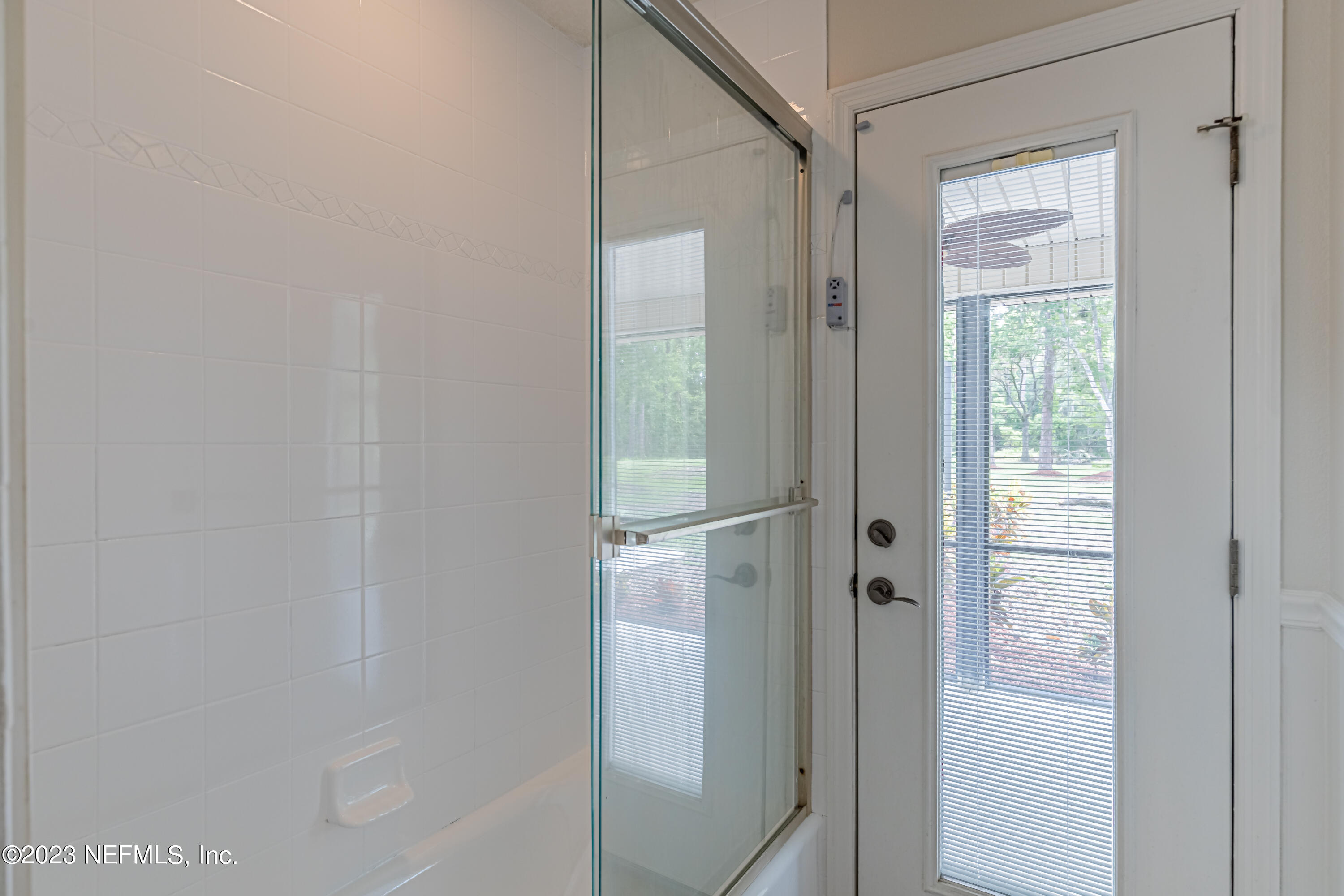 1193 Marlee Road St. Johns, FL 32259 - Photo 27 of 63 a bathroom with a glass shower door