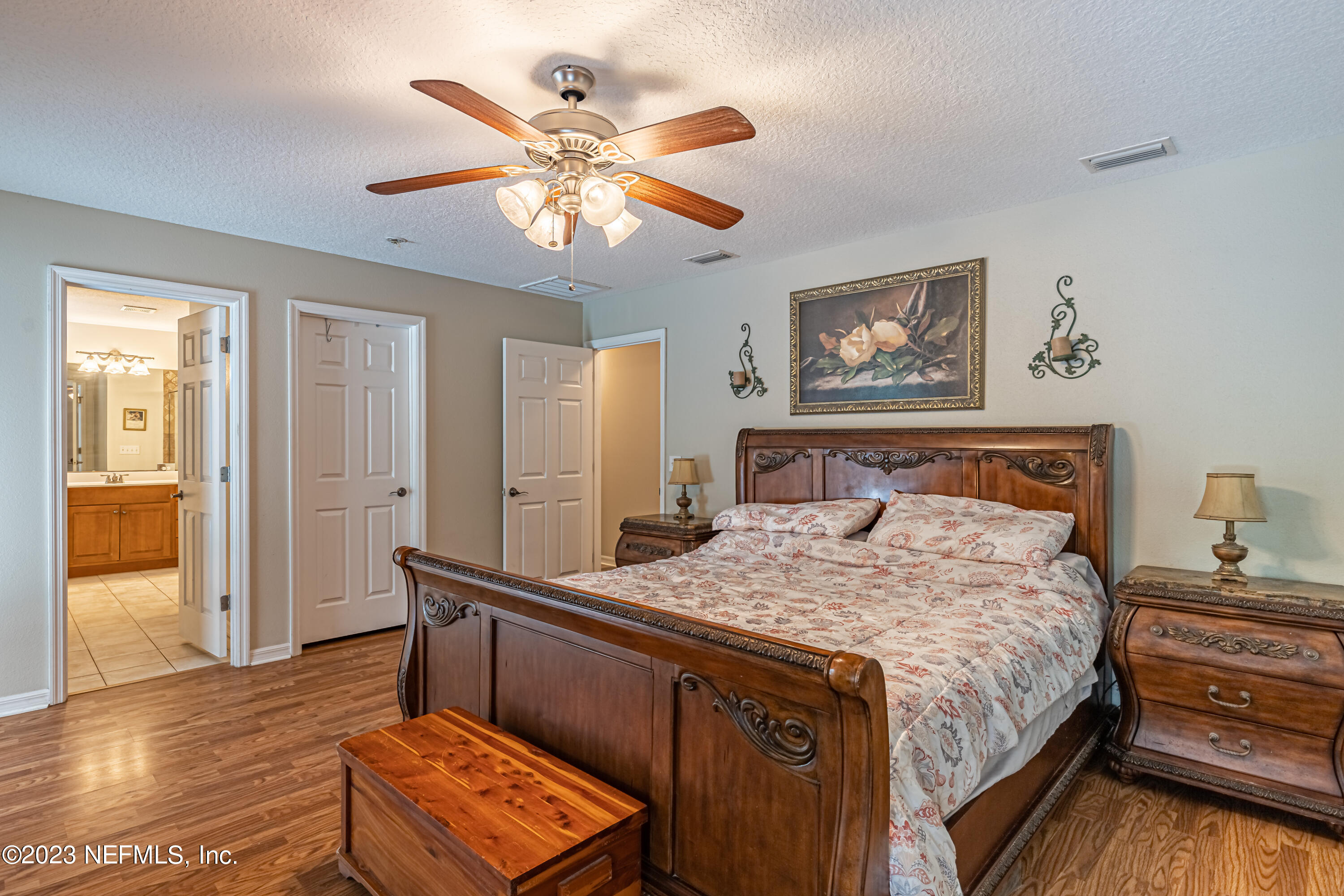 1193 Marlee Road St. Johns, FL 32259 - Photo 32 of 63 a bedroom with a bed and a chandelier