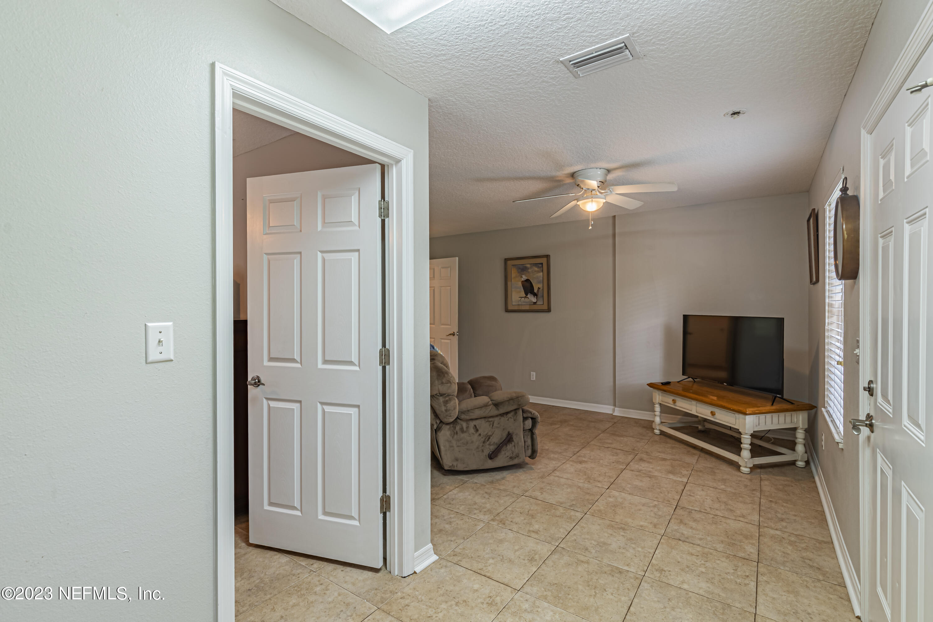 1193 Marlee Road St. Johns, FL 32259 - Photo 41 of 63 a living room with furniture and a flat screen tv