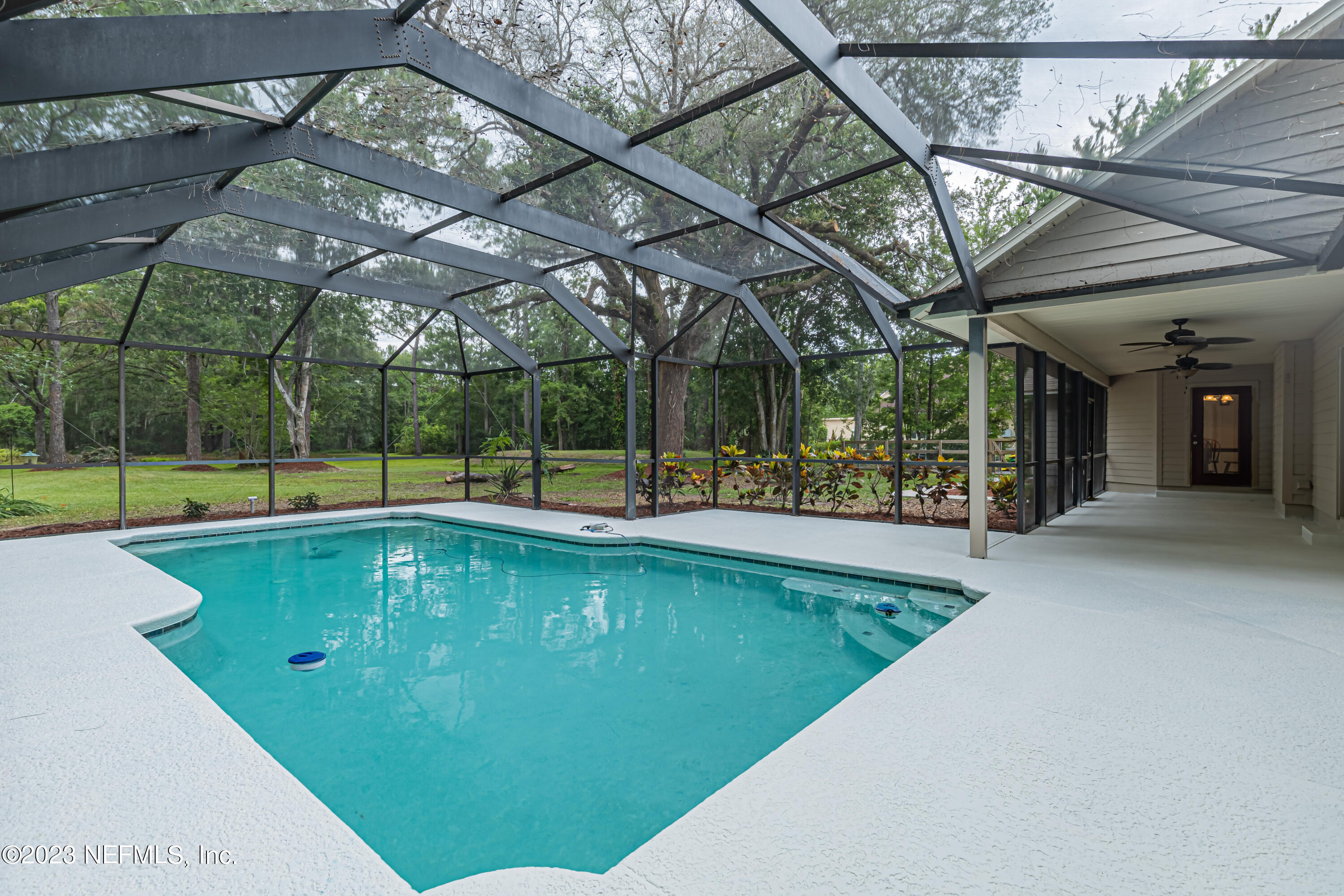 1193 Marlee Road St. Johns, FL 32259 - Photo 47 of 63 a view of a swimming pool with a patio