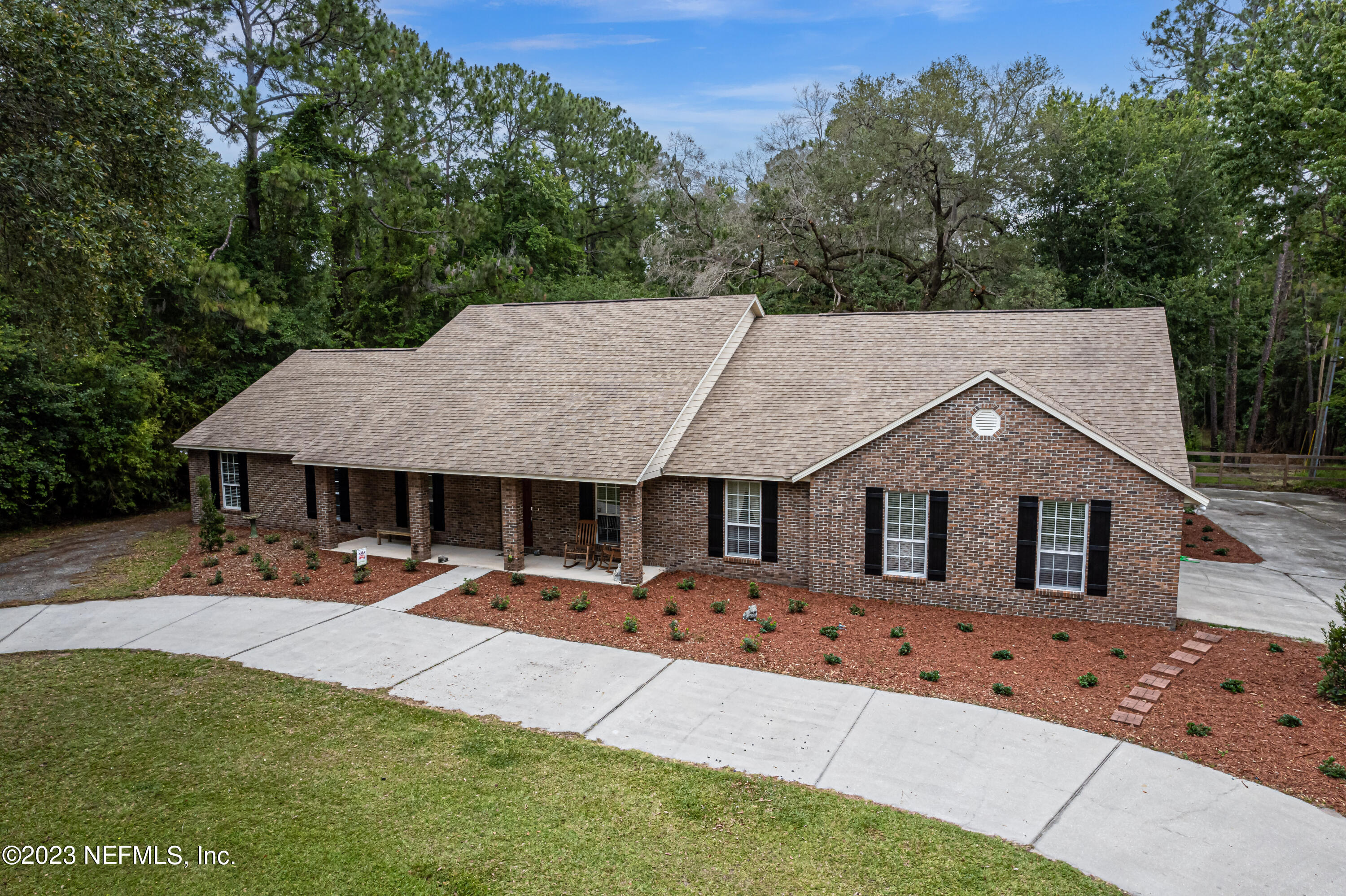 1193 Marlee Road St. Johns, FL 32259 - Photo 51 of 63 a front view of a house with a yard and trees